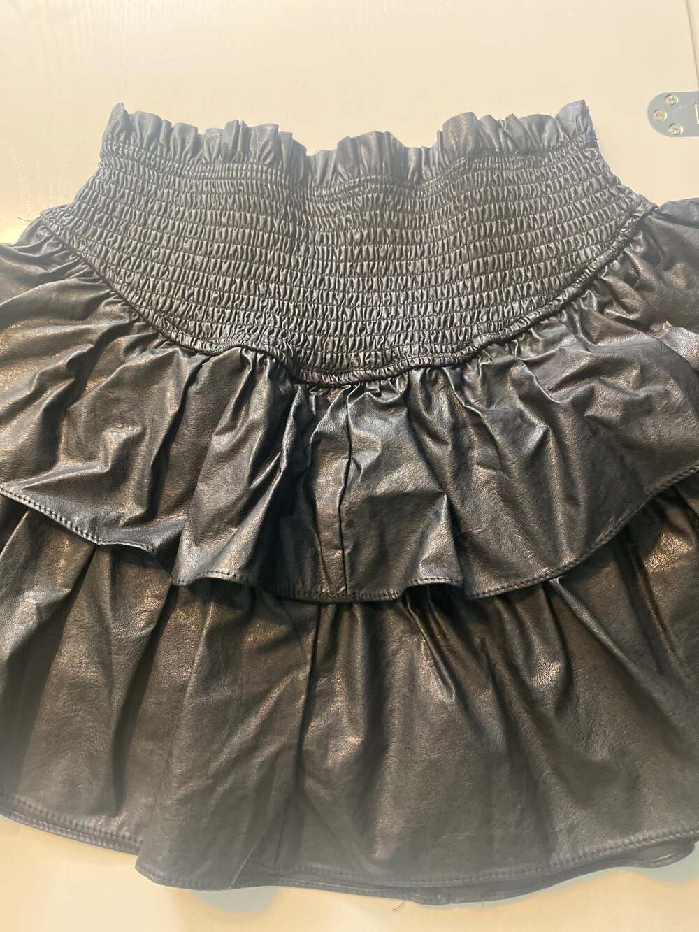 Small black leather looking skorts.